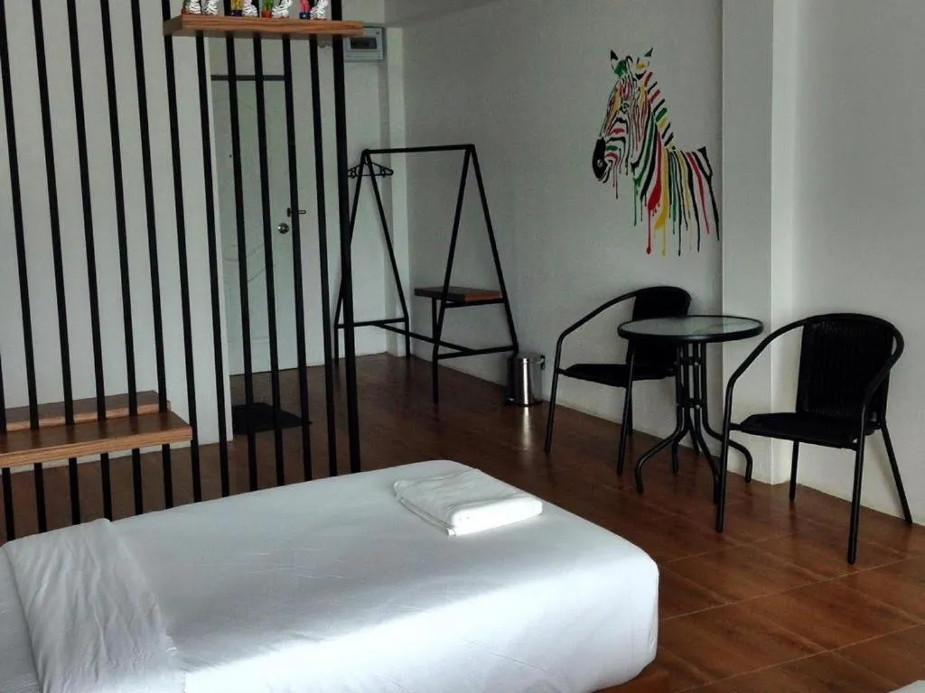 Bed in The Pride Hotel At Laemsing