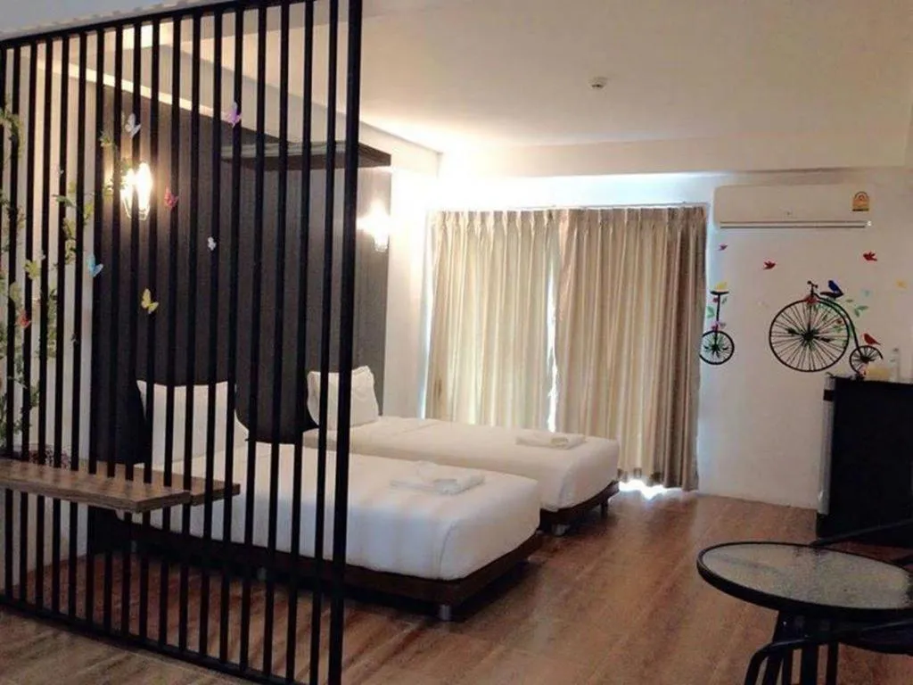 Bed in The Pride Hotel At Laemsing