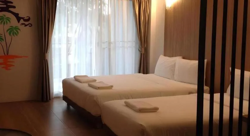 Bed in The Pride Hotel At Laemsing