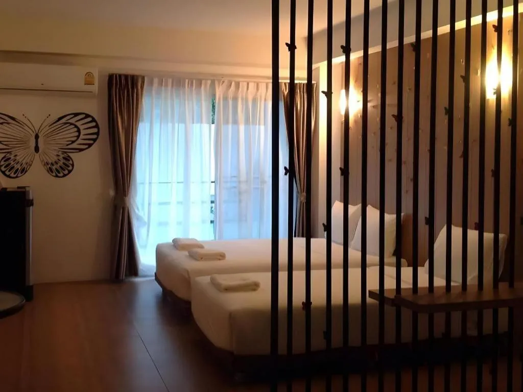 Bed in The Pride Hotel At Laemsing