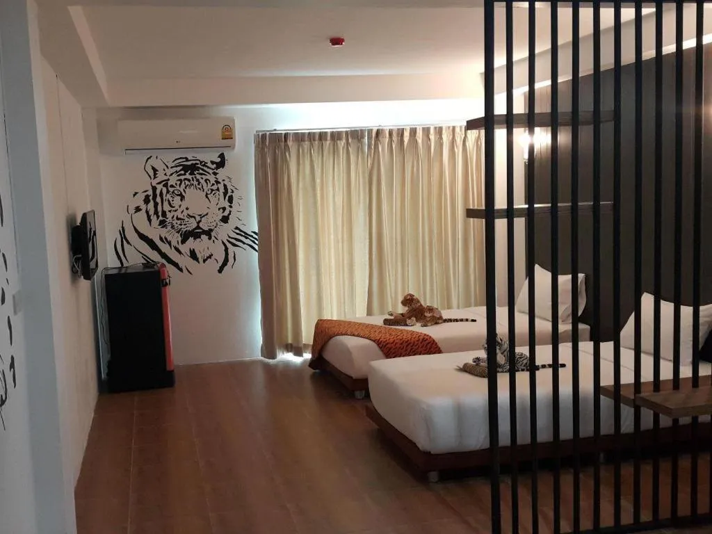 Bed in The Pride Hotel At Laemsing