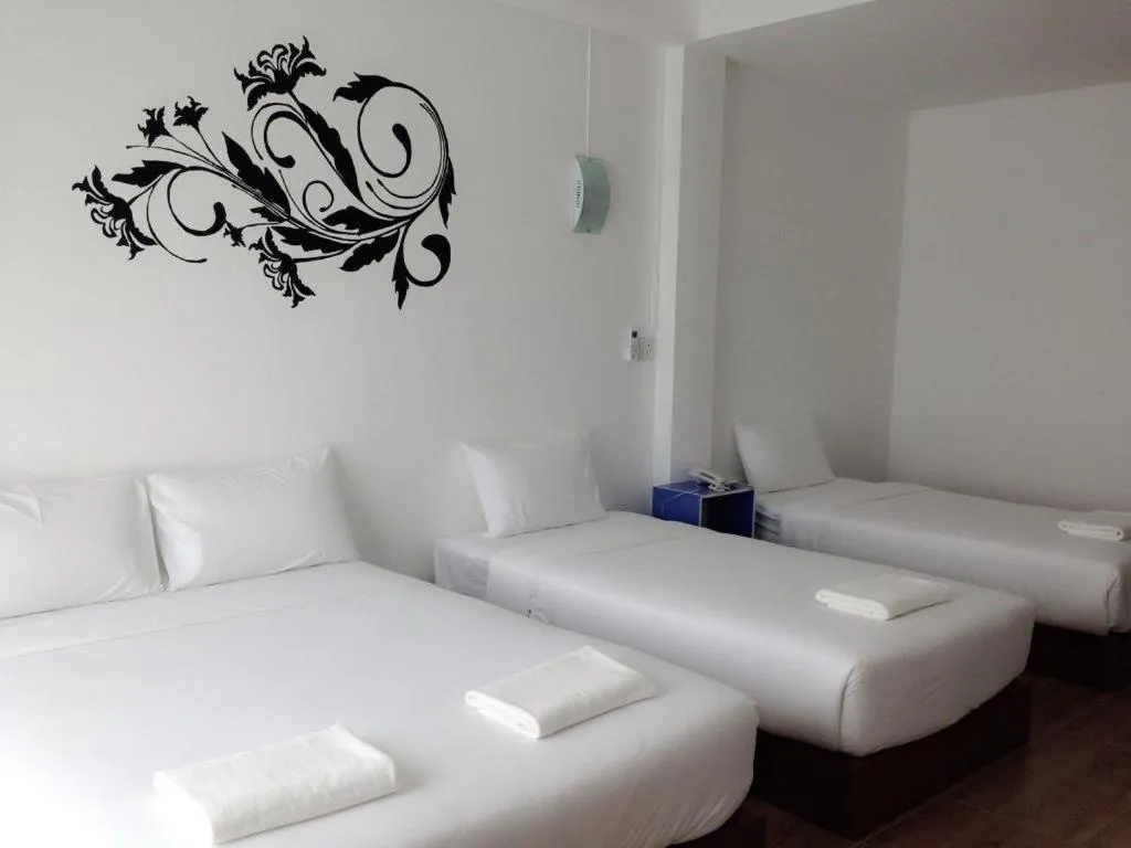 Bed in The Pride Hotel At Laemsing