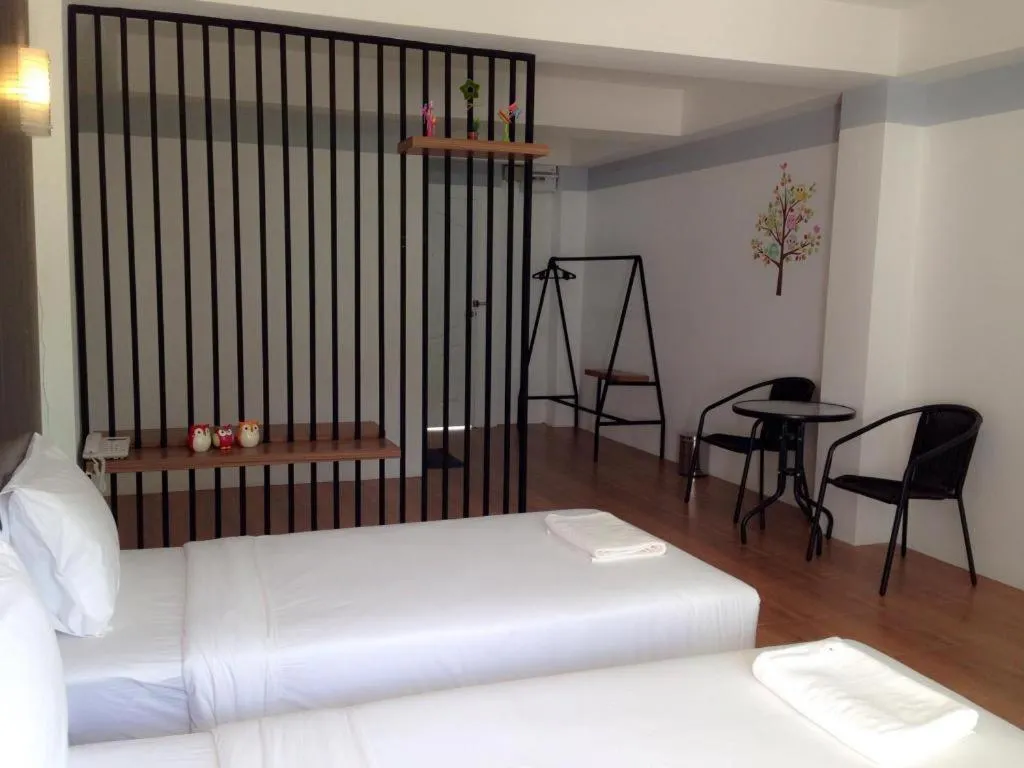 Bed in The Pride Hotel At Laemsing