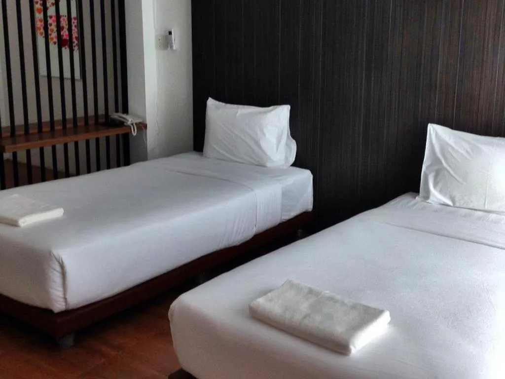 Bed in The Pride Hotel At Laemsing