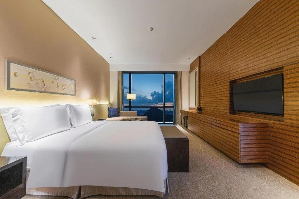 Bed in New World Guiyang Hotel