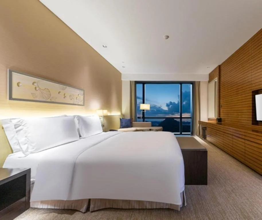 Bed in New World Guiyang Hotel