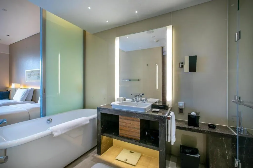 Bed in New World Guiyang Hotel