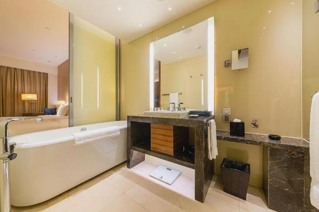 Bed in New World Guiyang Hotel