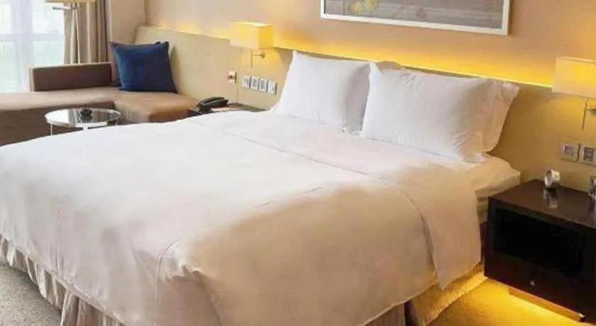 Bed in New World Guiyang Hotel