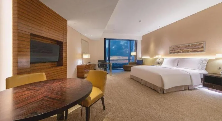 Bed in New World Guiyang Hotel