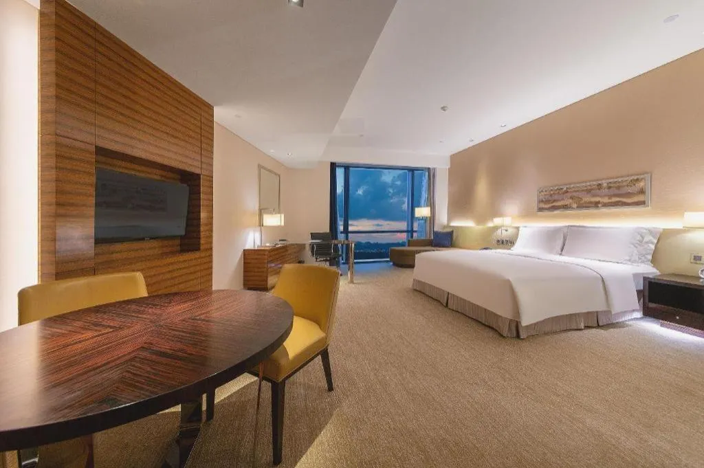 Bed in New World Guiyang Hotel