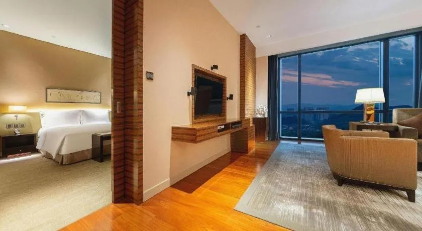 Bed in New World Guiyang Hotel