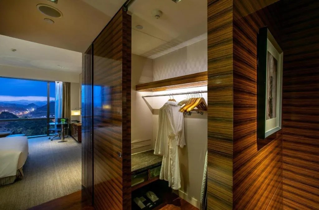 Bed in New World Guiyang Hotel