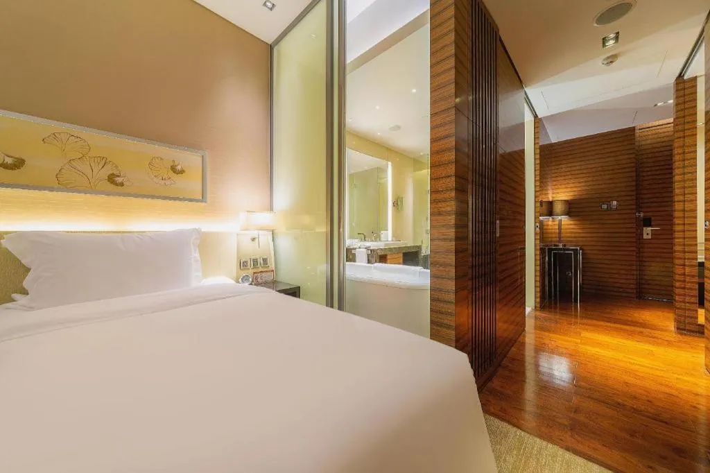 Bed in New World Guiyang Hotel