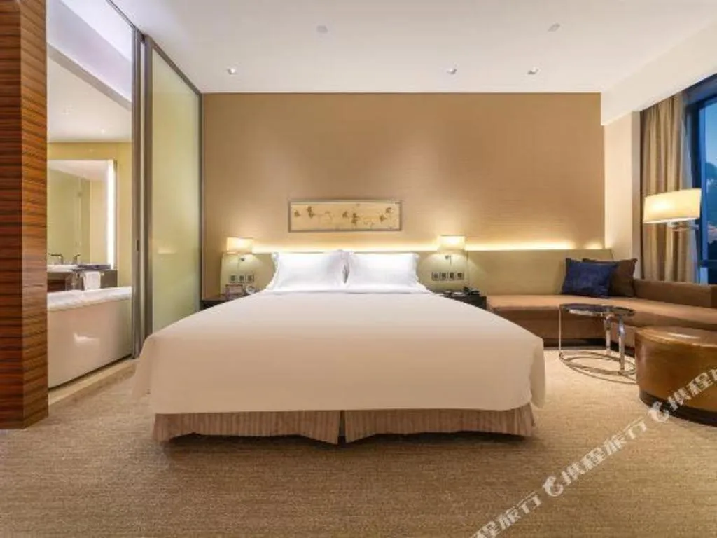 Bed in New World Guiyang Hotel