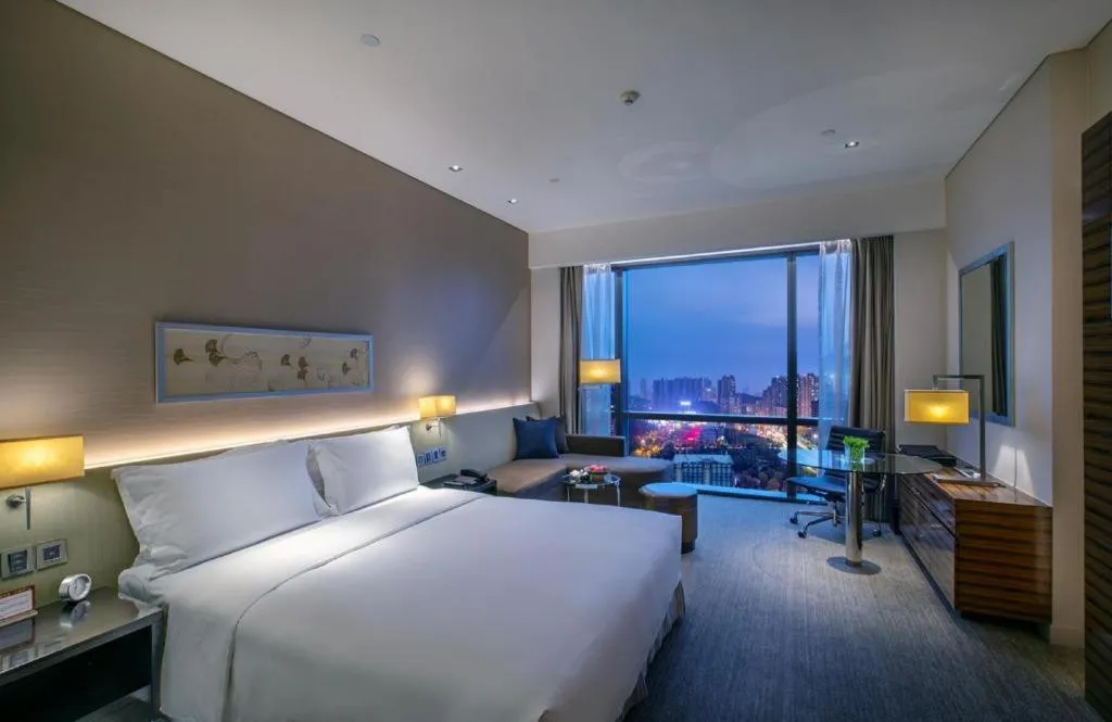 Bed in New World Guiyang Hotel
