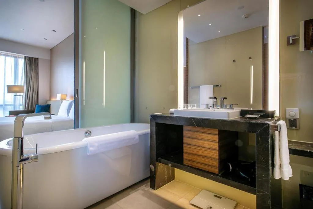 Bed in New World Guiyang Hotel