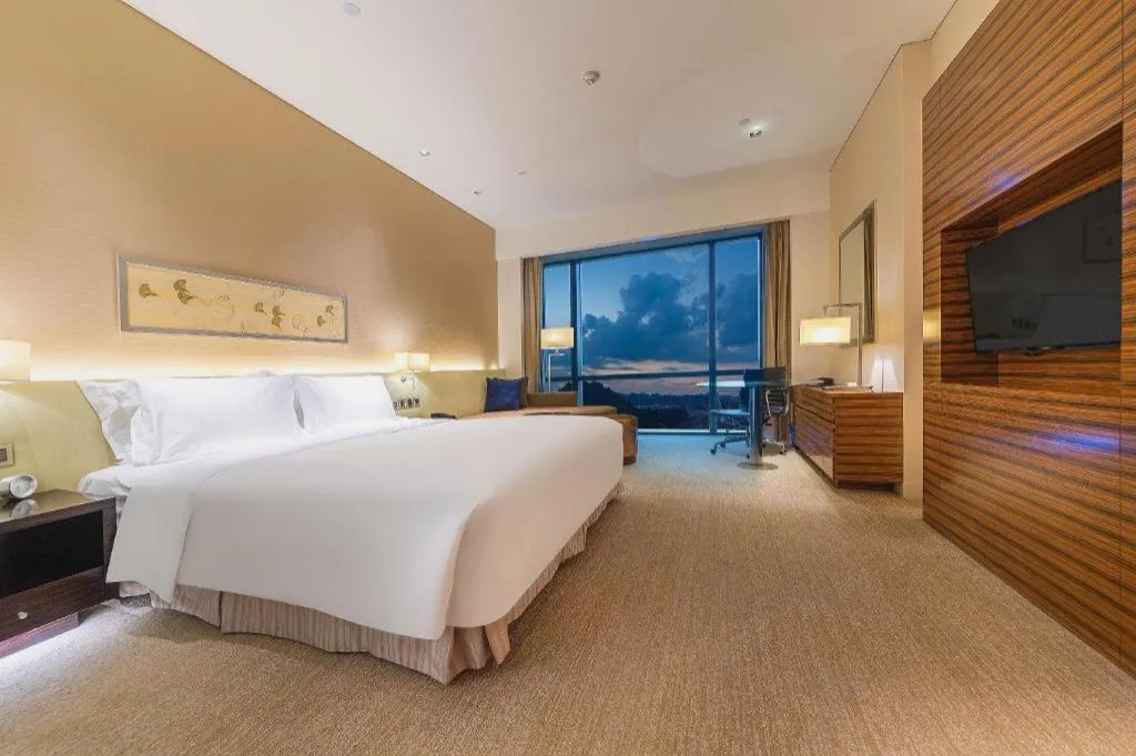 Bed in New World Guiyang Hotel