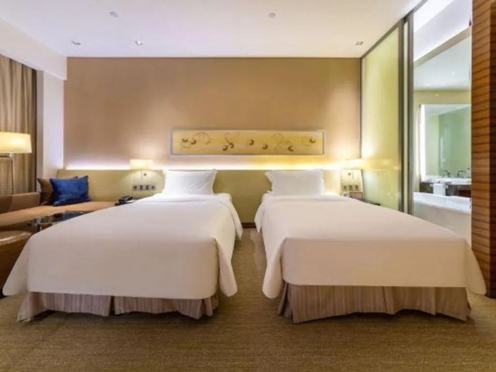 Bed in New World Guiyang Hotel