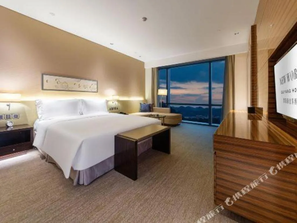 Bed in New World Guiyang Hotel