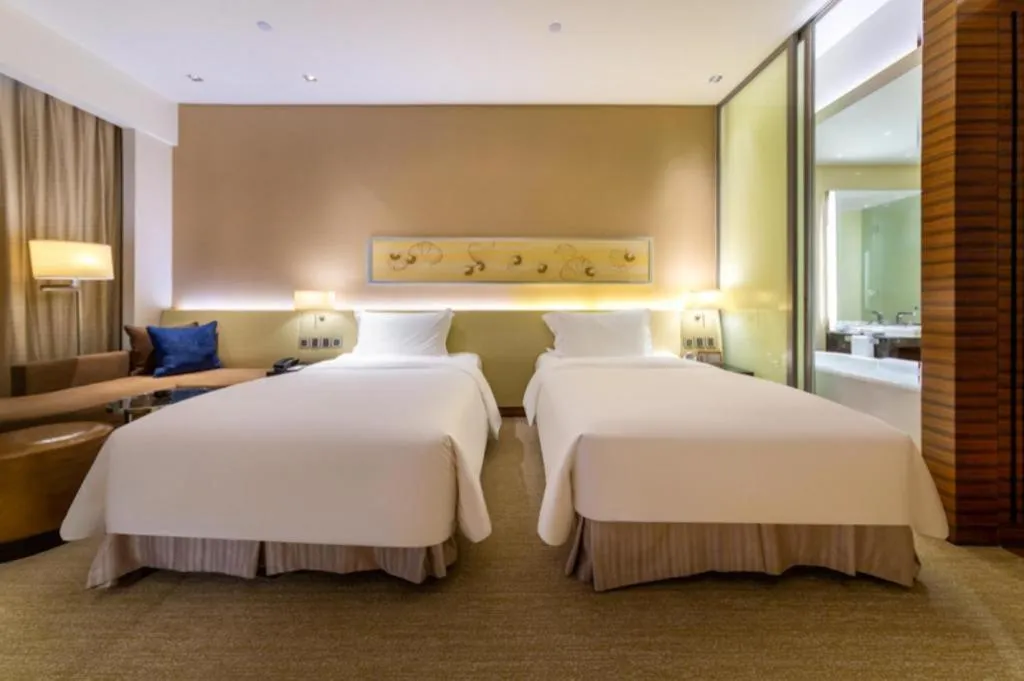Bed in New World Guiyang Hotel