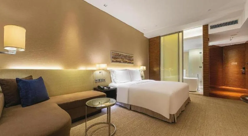 Bed in New World Guiyang Hotel