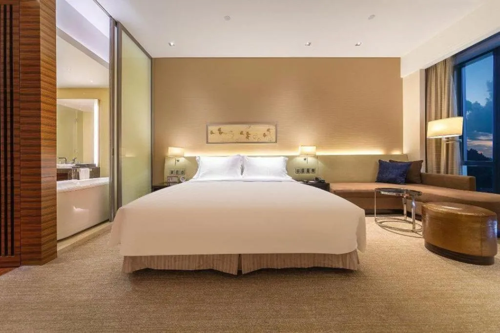 Bed in New World Guiyang Hotel
