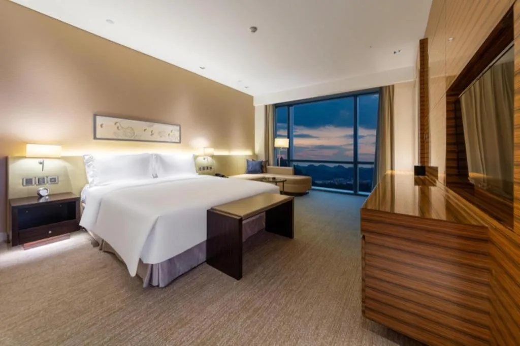 Bed in New World Guiyang Hotel