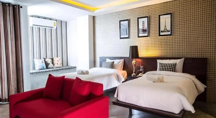 Bed in M Boutique Resort