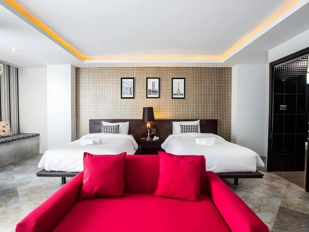 Bed in M Boutique Resort