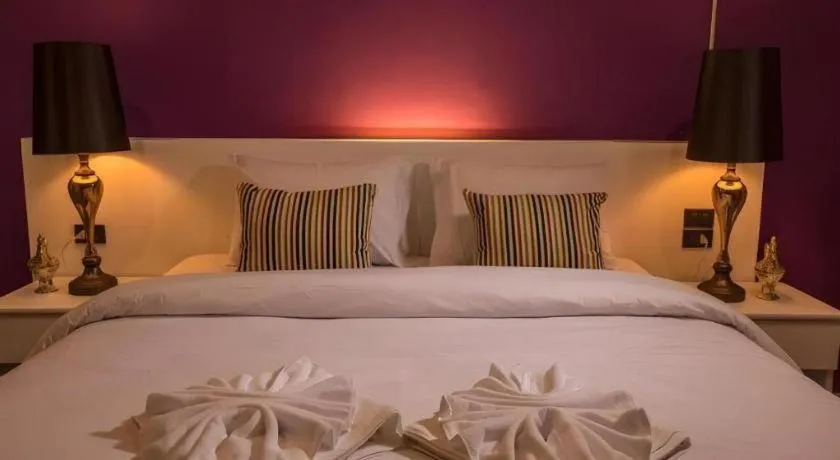 Bed in M Boutique Resort