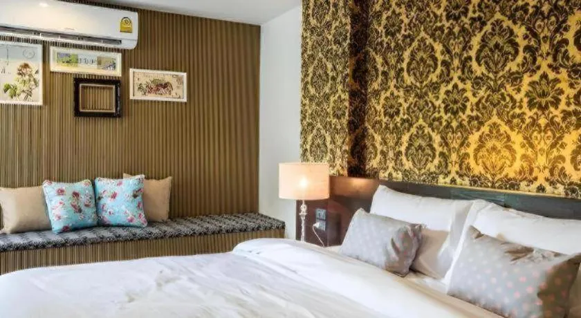 Bed in M Boutique Resort