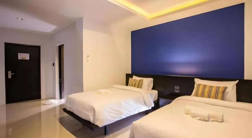 Bed in M Boutique Resort