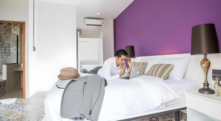 Bed in M Boutique Resort