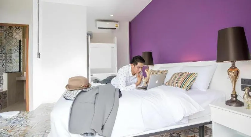 Bed in M Boutique Resort