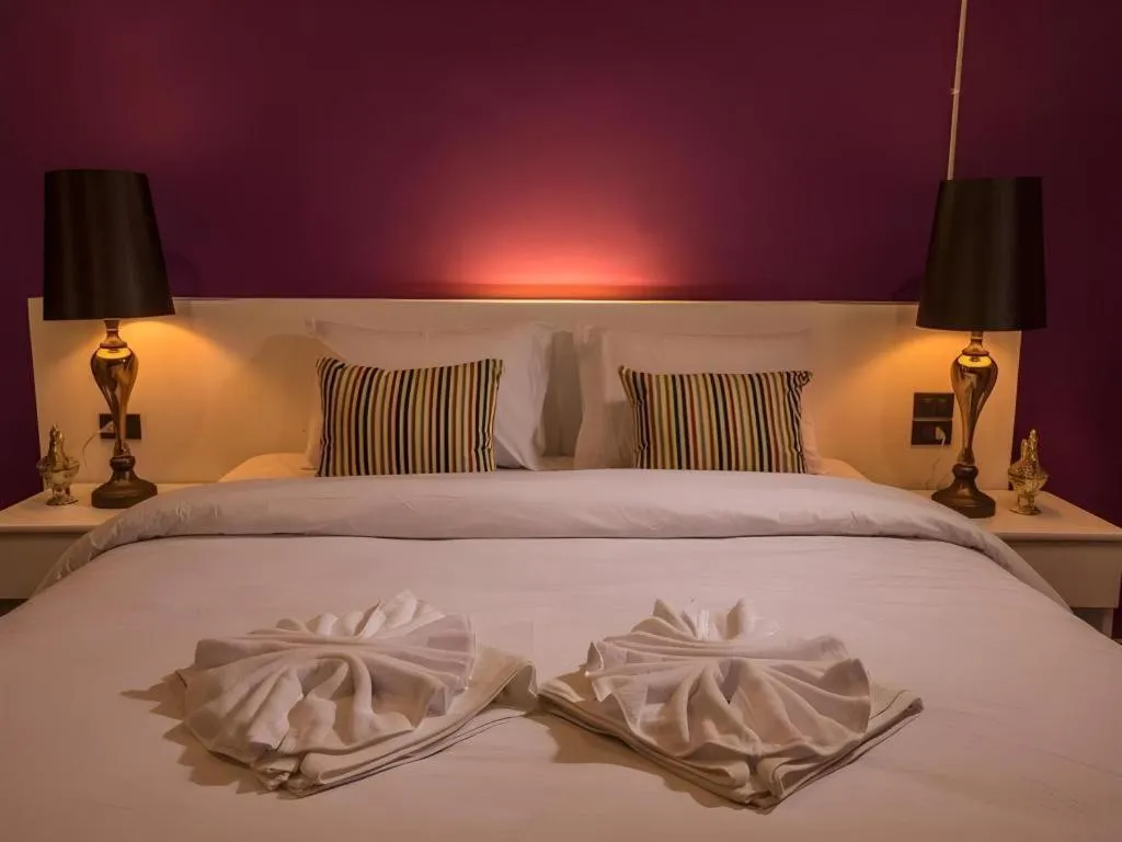 Bed in M Boutique Resort
