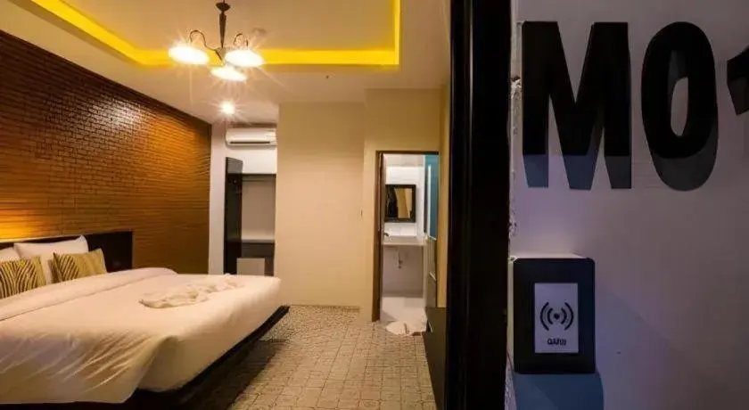 Bed in M Boutique Resort Bed in M Boutique Resort