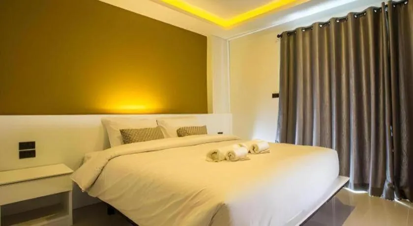 Bed in M Boutique Resort