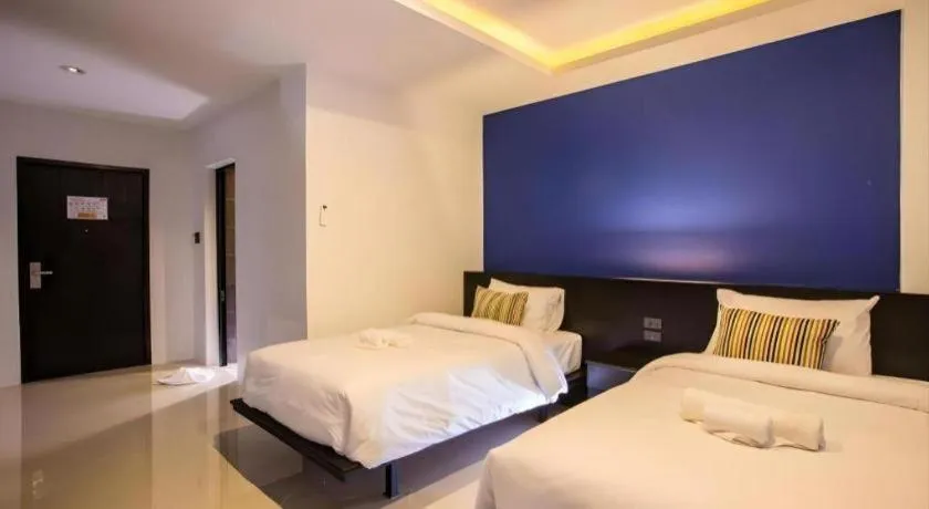 Bed in M Boutique Resort