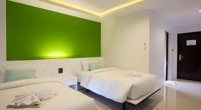 Bed in M Boutique Resort