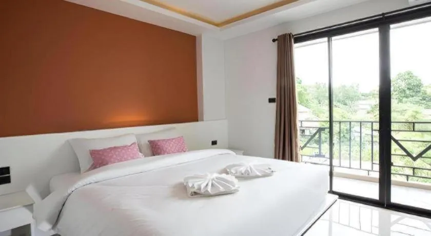 Bed in M Boutique Resort