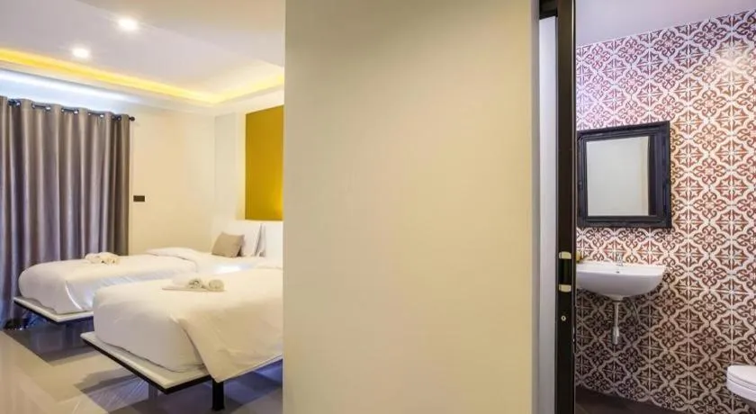 Bed in M Boutique Resort