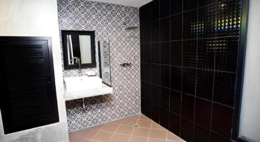 Bed in M Boutique Resort