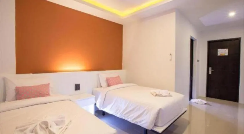 Bed in M Boutique Resort