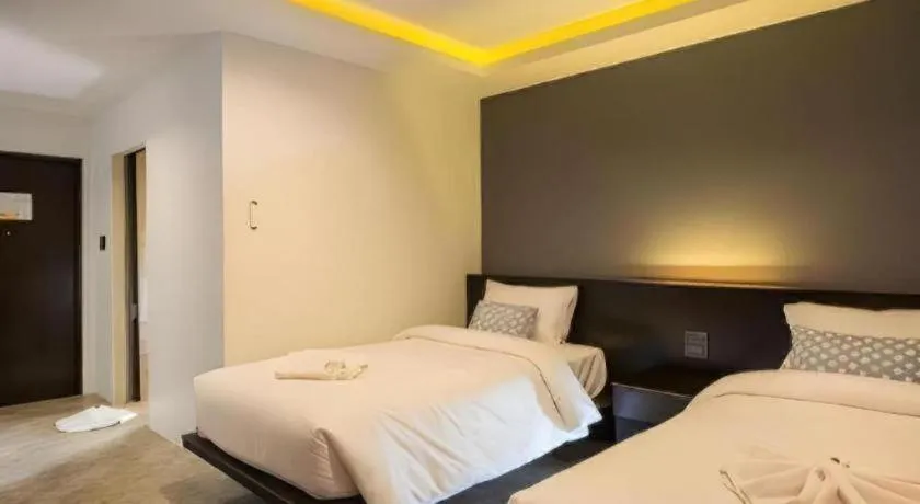 Bed in M Boutique Resort