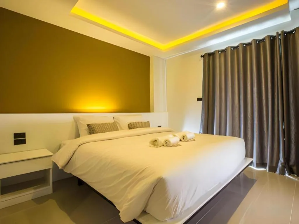 Bed in M Boutique Resort