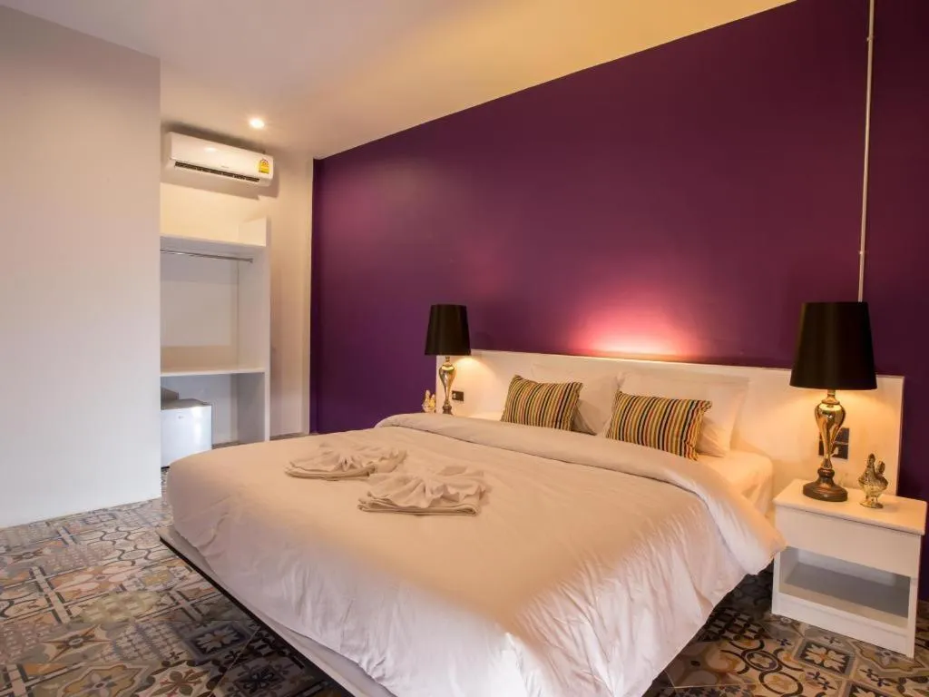 Bed in M Boutique Resort