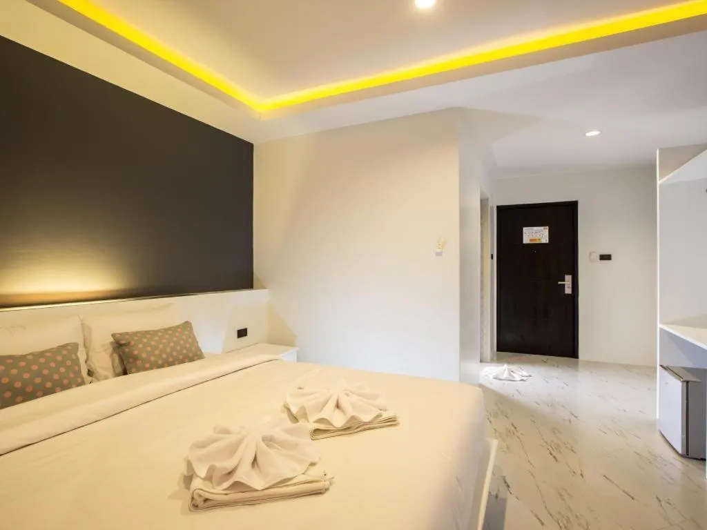 Bed in M Boutique Resort