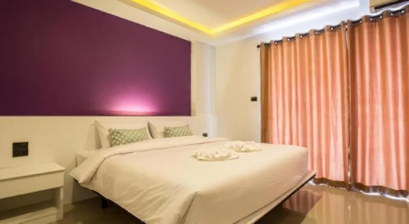 Bed in M Boutique Resort