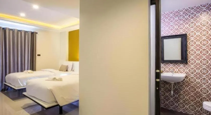 Bed in M Boutique Resort